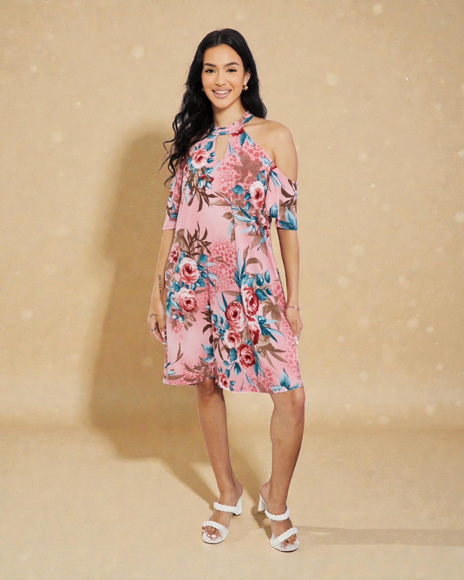 Woman wearing a floral dress against a beige background