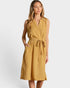 A woman modeling a sleeveless midi dress in a mustard yellow and white micro-pattern, featuring a V-neckline, tie waist belt, and side pockets, set against a plain light gray background.