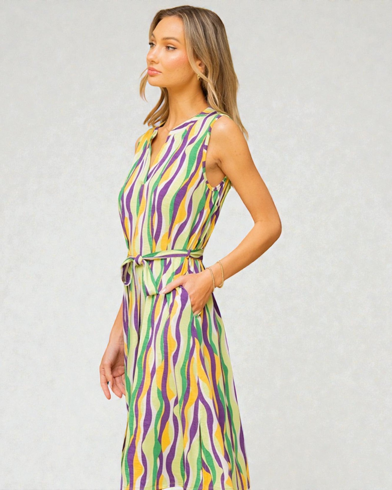 Woman wearing a colorful dress with a white background