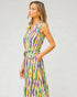 Woman wearing a colorful dress with a white background