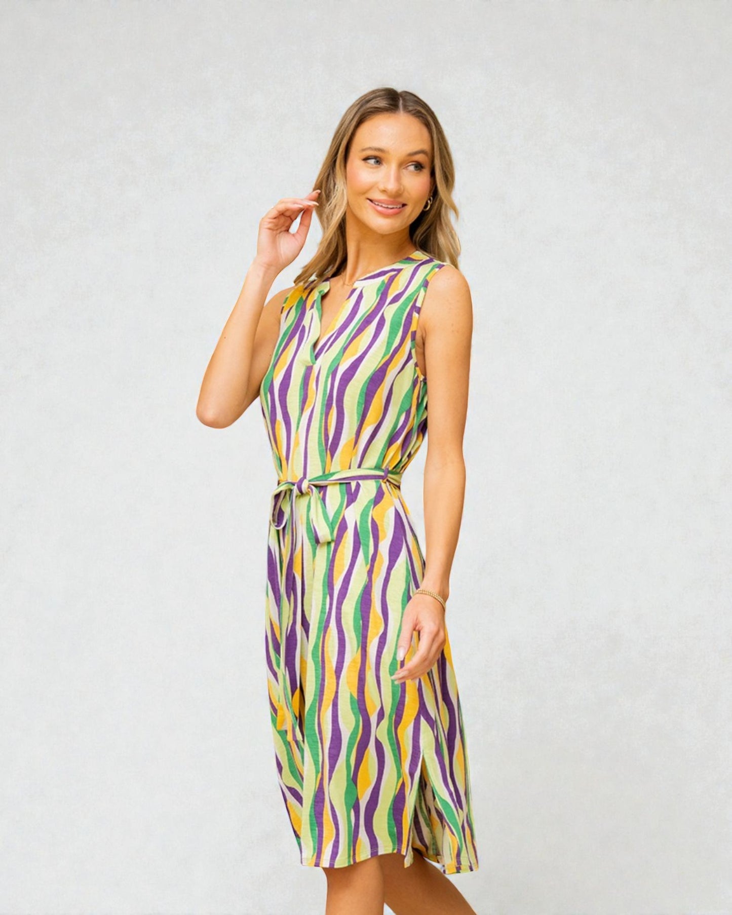 Woman wearing a colorful dress with a white background