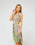 Woman wearing a colorful dress with a white background