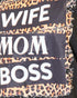 Close-up of a garment featuring the words 'WIFE', 'MOM', and 'BOSS' in large white letters on black panels, layered with leopard print fabric.