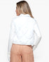 A woman shown from the back wearing a white quilted puffer jacket and peach-colored pants against a plain white background.