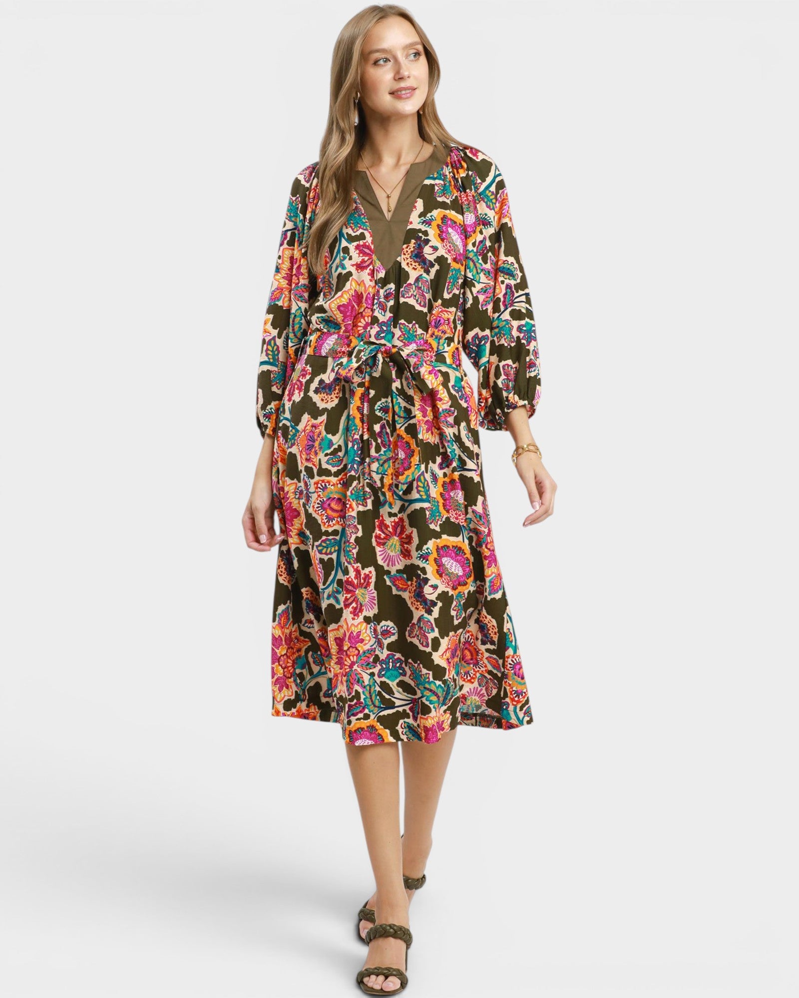 Woman wearing a floral dress on a white background