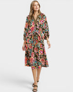 Woman wearing a floral dress on a white background