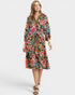 Woman wearing a floral dress on a white background