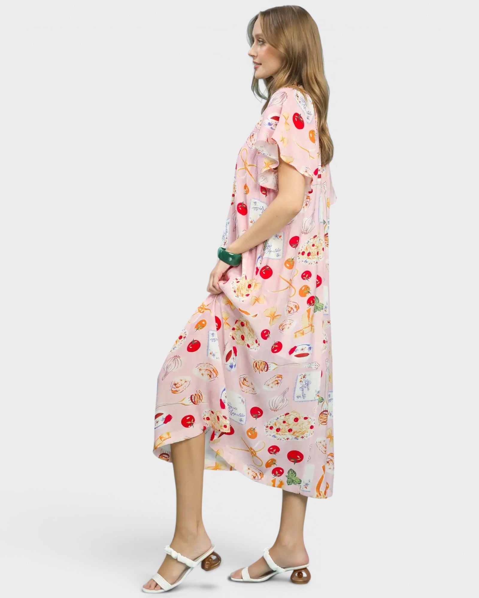 Woman wearing a colorful dress with a white background