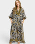 Woman wearing a patterned dress on a white background