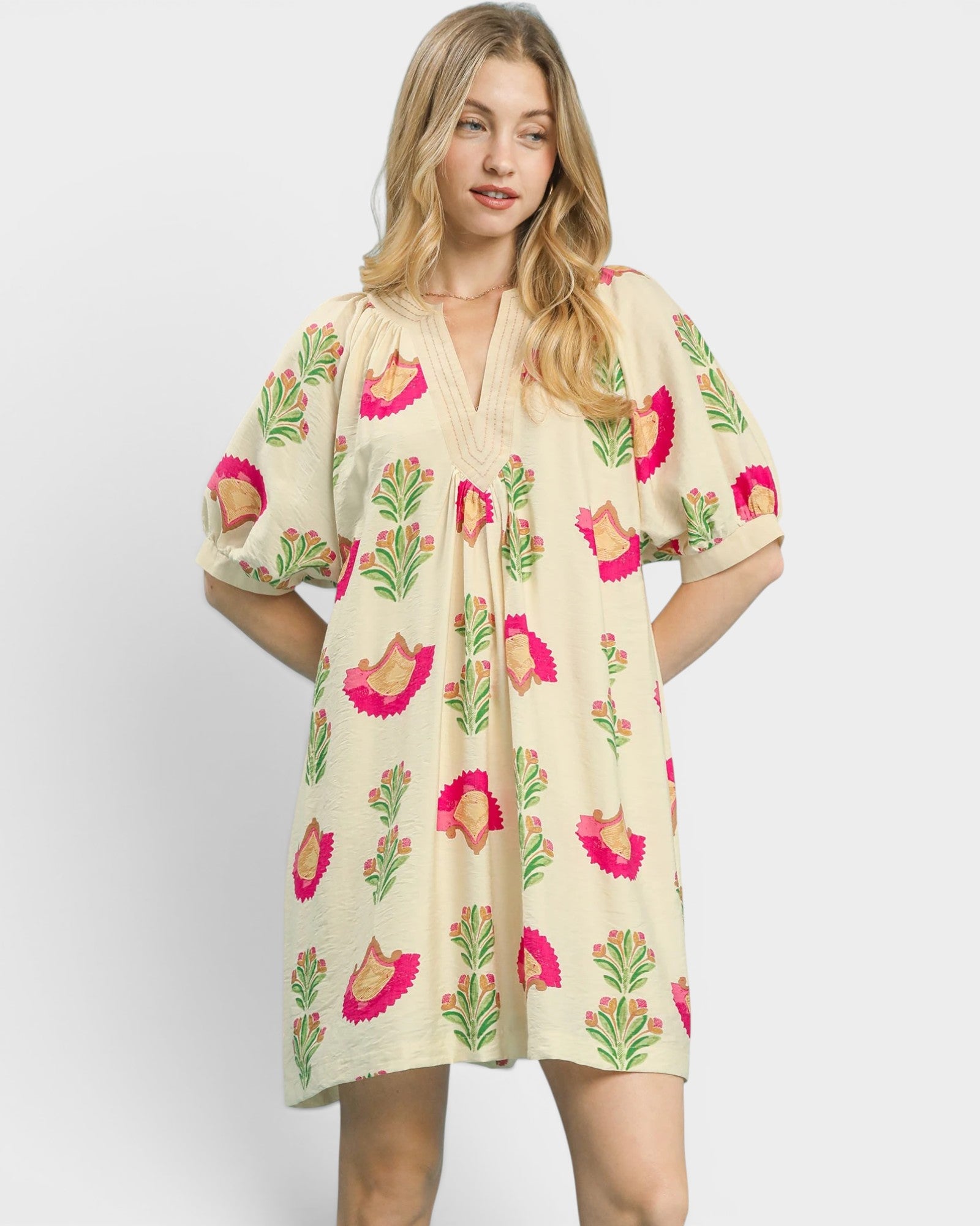 Woman wearing a floral dress on a white background