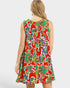 Woman wearing a colorful floral dress on a white background