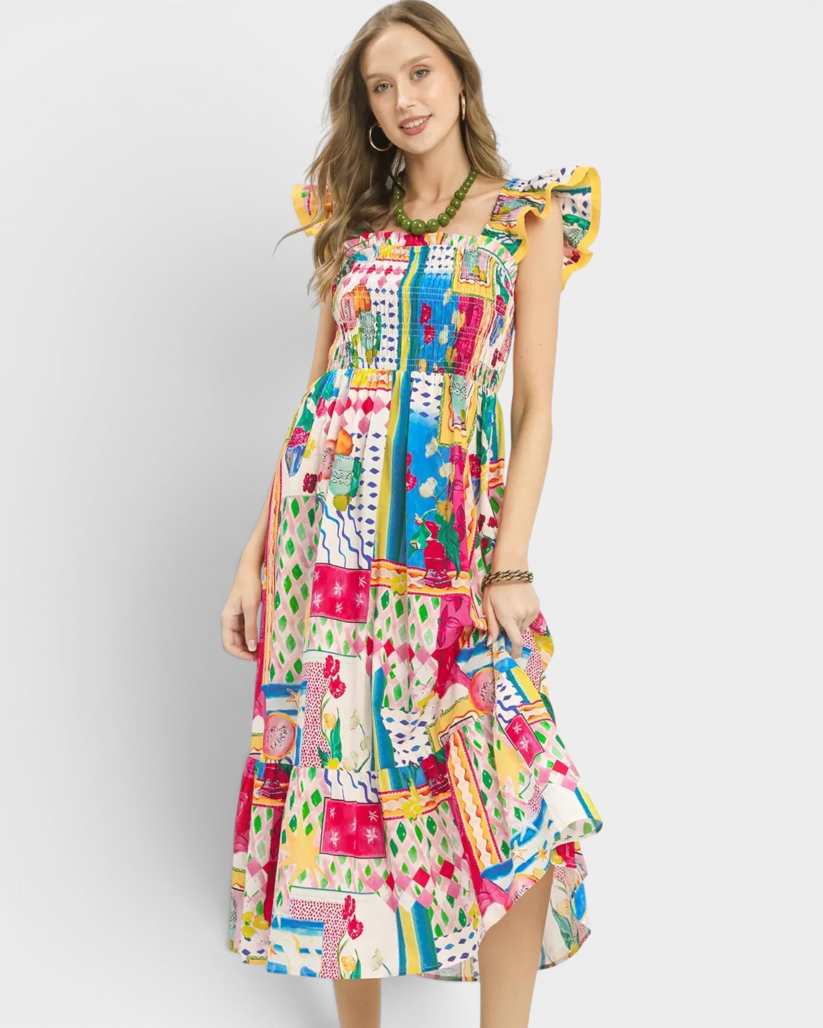 Woman wearing a colorful patterned dress on a white background
