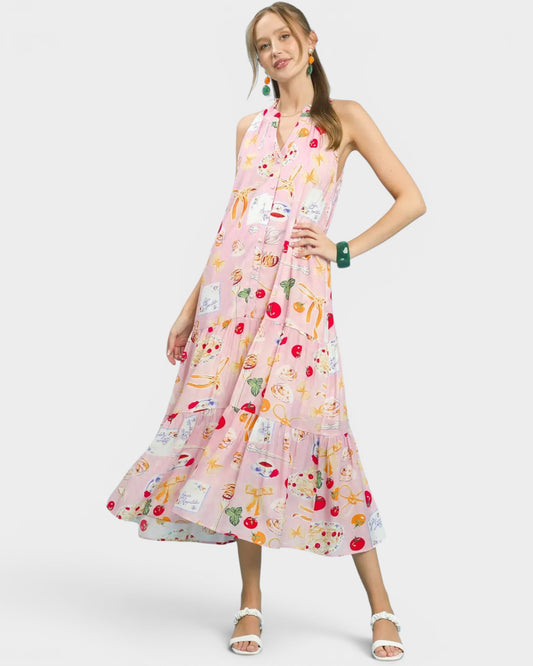 Woman wearing a colorful floral dress on a white background
