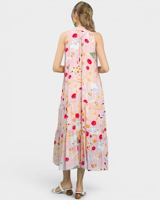 Woman wearing a sleeveless floral dress on a white background
