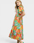 Woman wearing a colorful dress with a white background