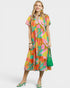 Woman wearing a colorful dress with a white background