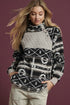 Woman wearing a patterned sweater with a maroon background
