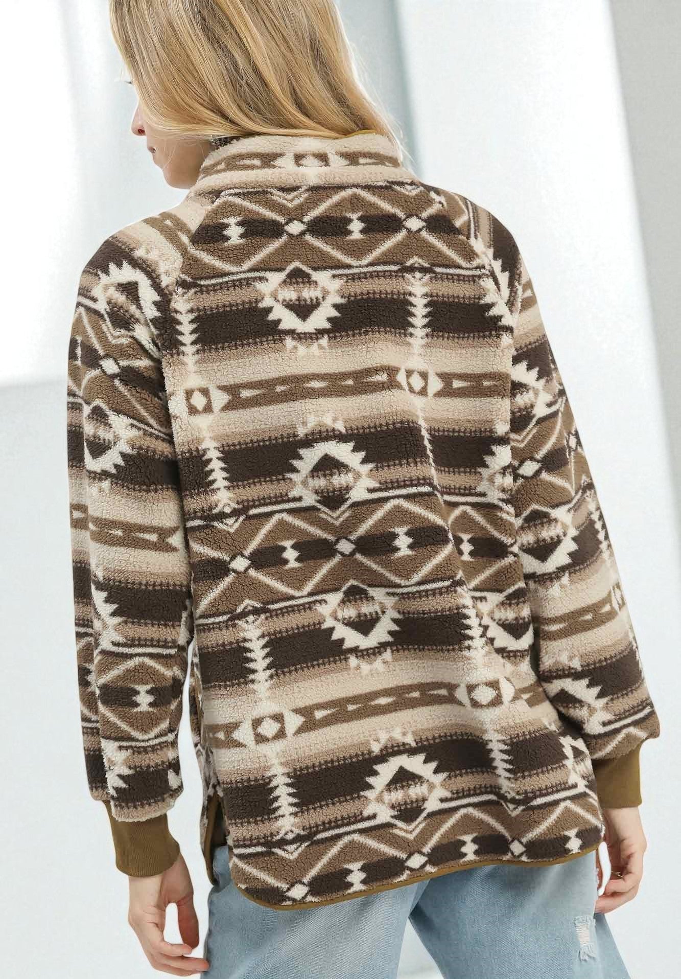 Person wearing a patterned brown sweater with a white background