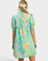 Woman wearing a colorful floral dress on a white background