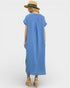 Woman wearing a blue dress with a straw hat on a white background