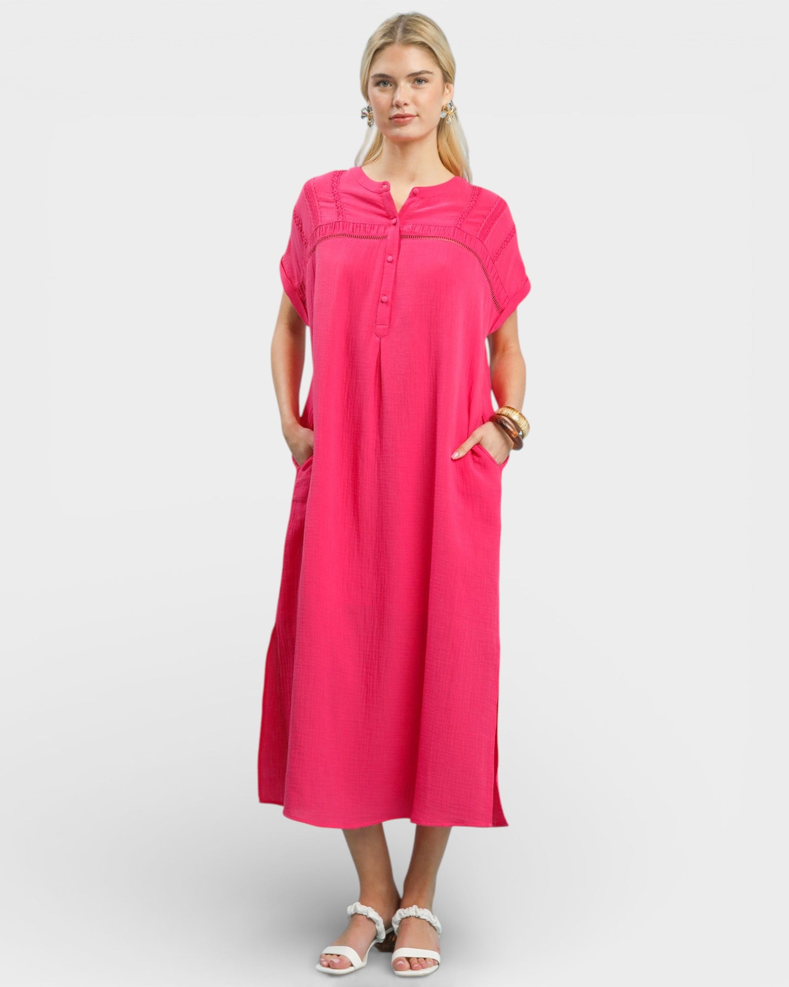 Woman wearing a pink dress on a white background