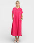 Woman wearing a pink dress on a white background