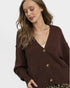 Woman wearing a brown cardigan on a white background