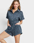 Woman wearing a blue romper on a white background