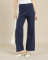 Navy blue pants worn by a person on a beige background