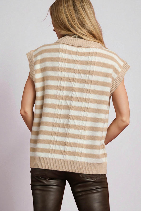 Woman wearing a beige and white striped sleeveless sweater vest on a light gray background