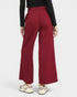 Red wide-leg pants worn by a person on a white background