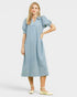 Woman wearing a light blue dress on a white background