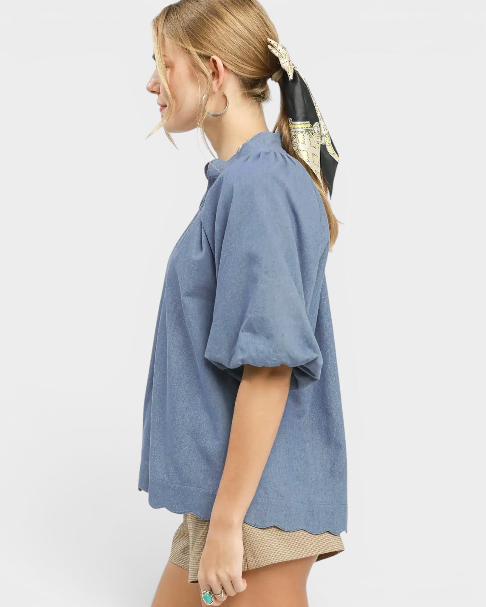 Woman wearing a blue shirt on a white background
