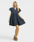 Woman wearing a blue striped dress on a white background