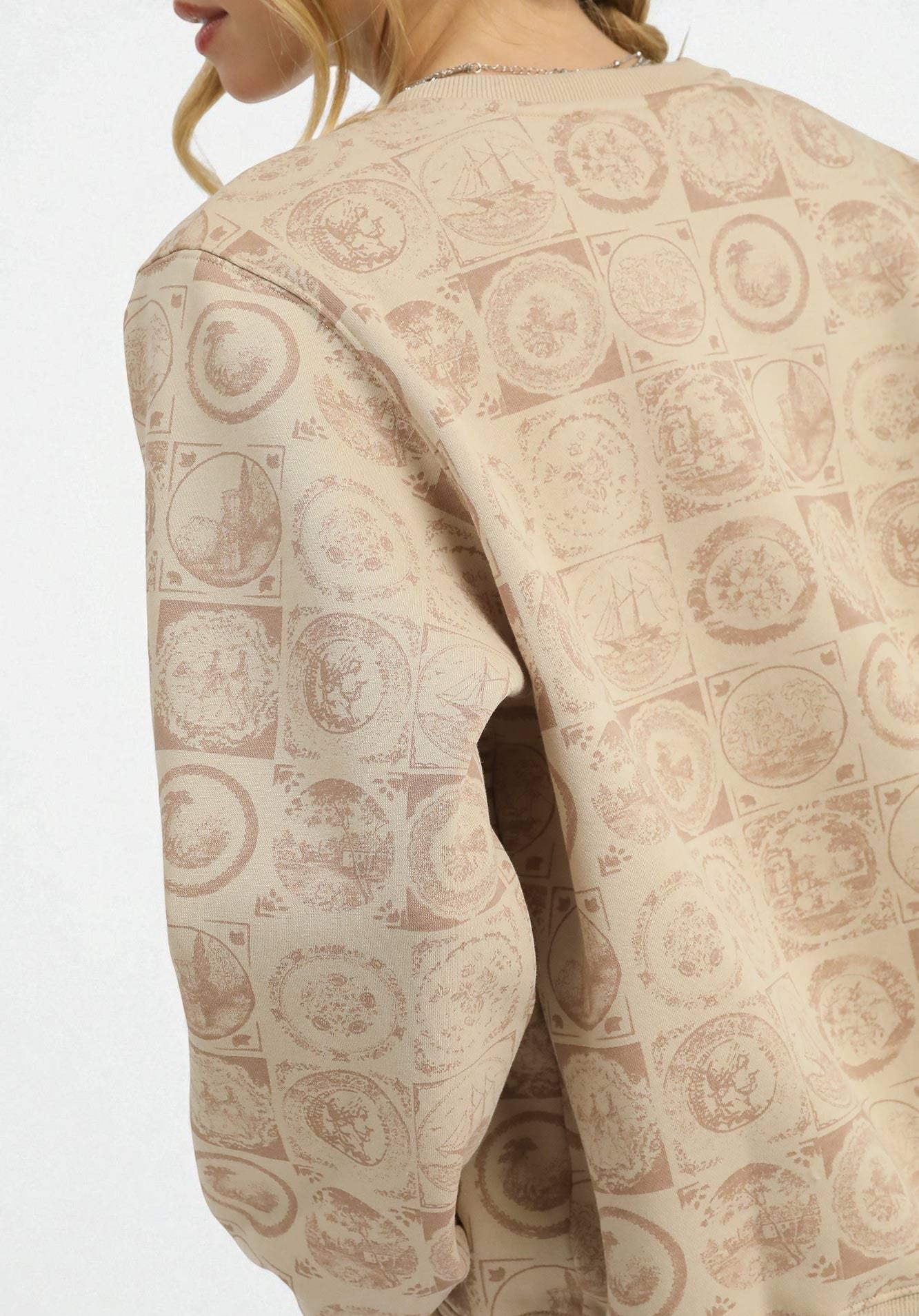 Beige patterned garment with a neutral background