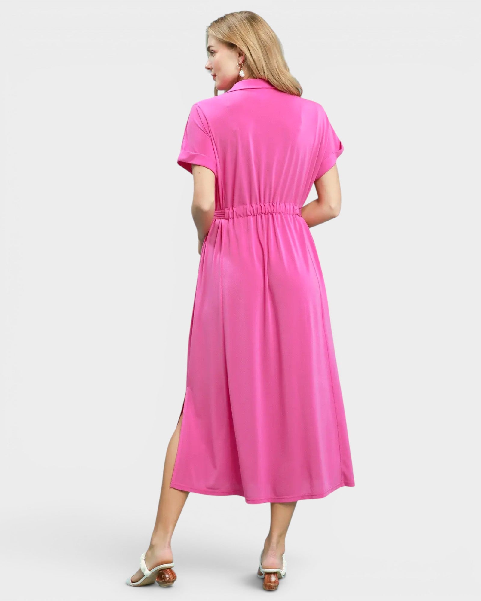Woman wearing a pink dress on a white background