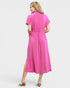 Woman wearing a pink dress on a white background