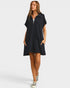 Woman wearing a black dress with a zipper on a white background