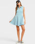 Woman wearing a light blue sleeveless dress on a white background