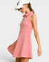 Woman wearing a pink dress with a white background