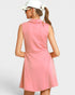 Woman wearing a pink dress with a white background
