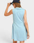 Woman wearing a light blue dress with a white background