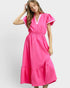 Woman wearing a bright pink dress on a white background