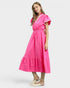 Woman wearing a bright pink dress on a white background