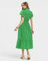Woman wearing a green dress on a white background
