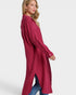 Woman wearing a long burgundy dress with a white background