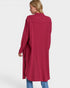 Woman wearing a long burgundy shirt on a white background