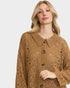 Woman wearing a brown knitted cardigan with a collar on a white background