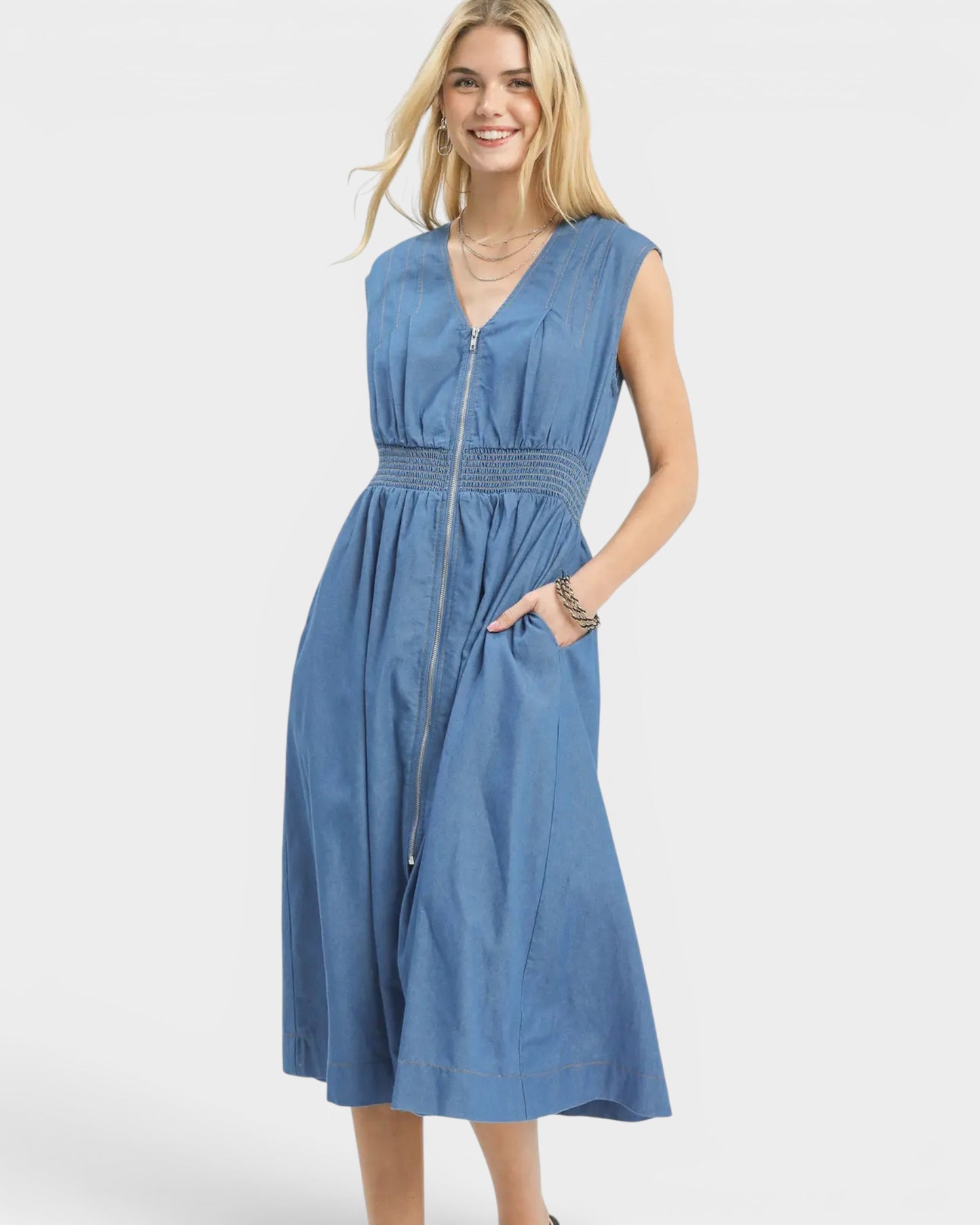 Woman wearing a blue dress on a white background