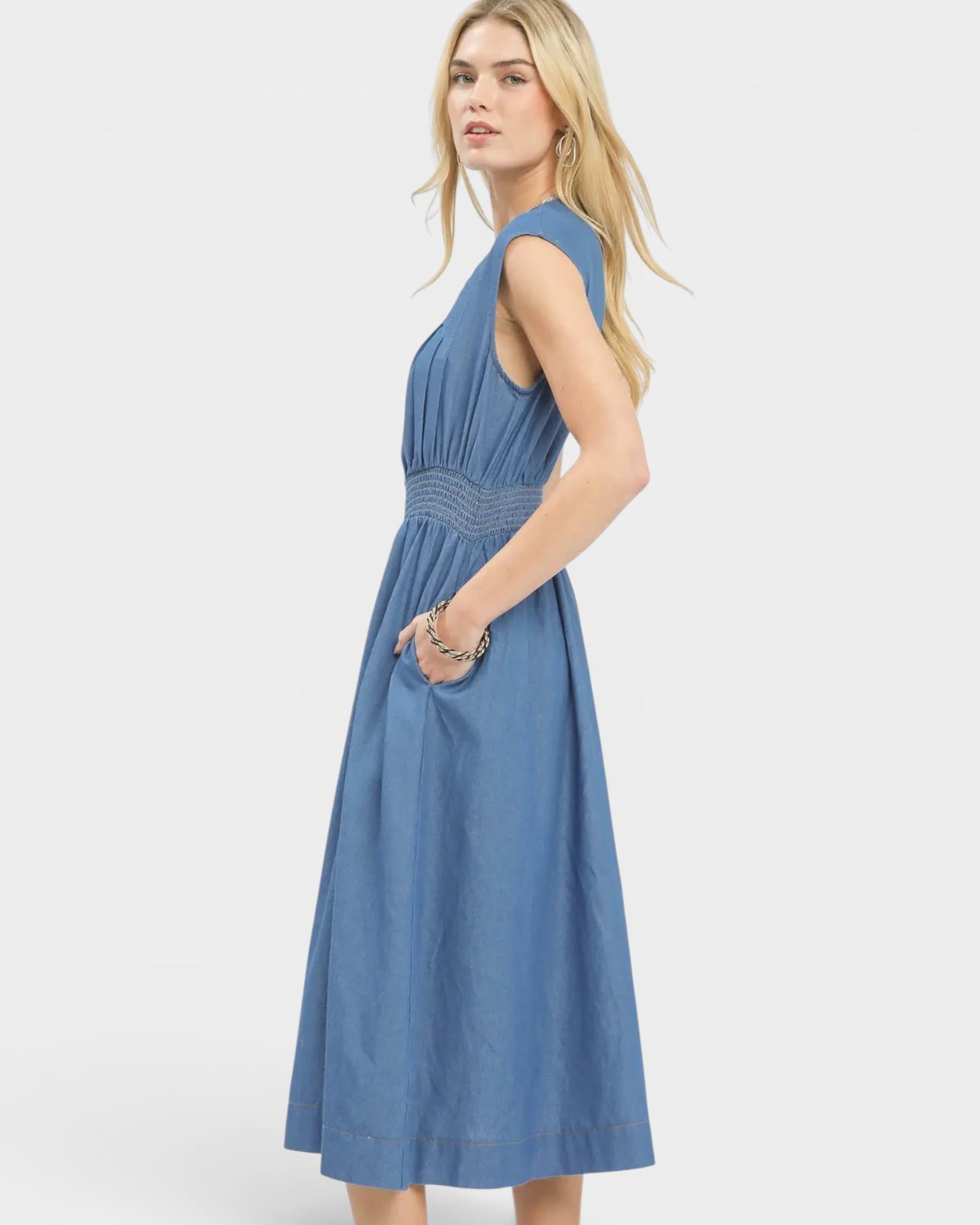 Woman wearing a blue dress on a white background
